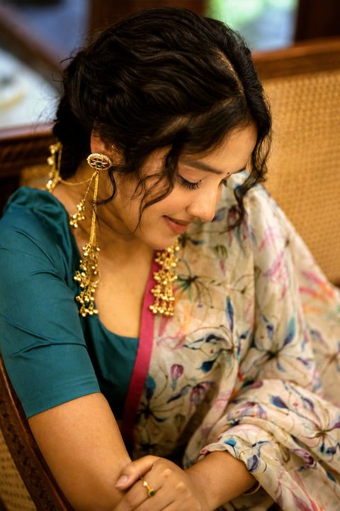 Anikha Surendran Glows in Teal and Ivory Floral Half-Saree
