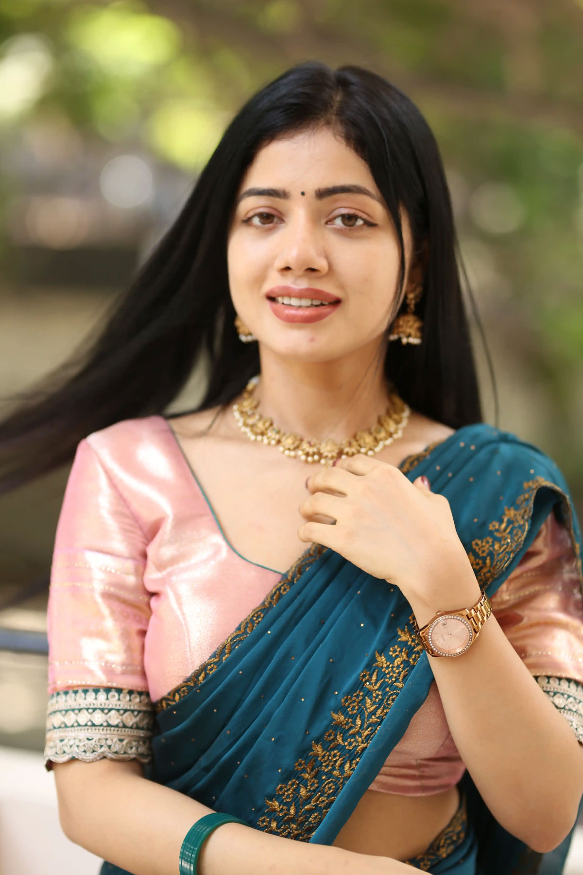 Bhairavi Ardhya Dazzles in Peach Satin Saree & Teal Dupatta