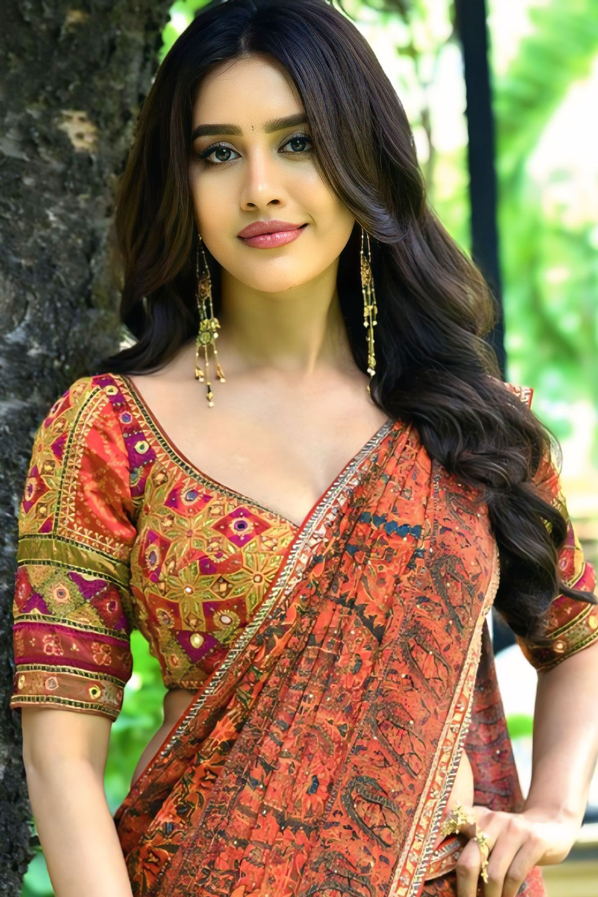 Nabha Natesh Radiates Charm in Rust Saree & Long Earrings