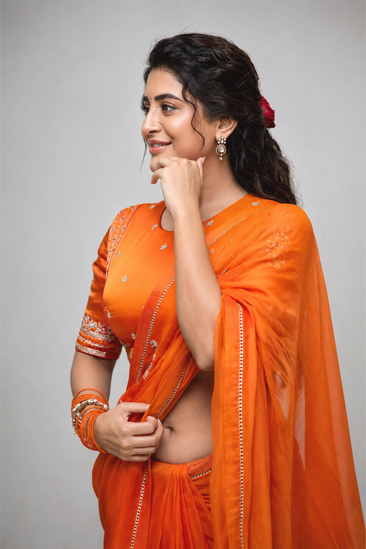 Actress Rashi Singh hot navel stills in orange saree