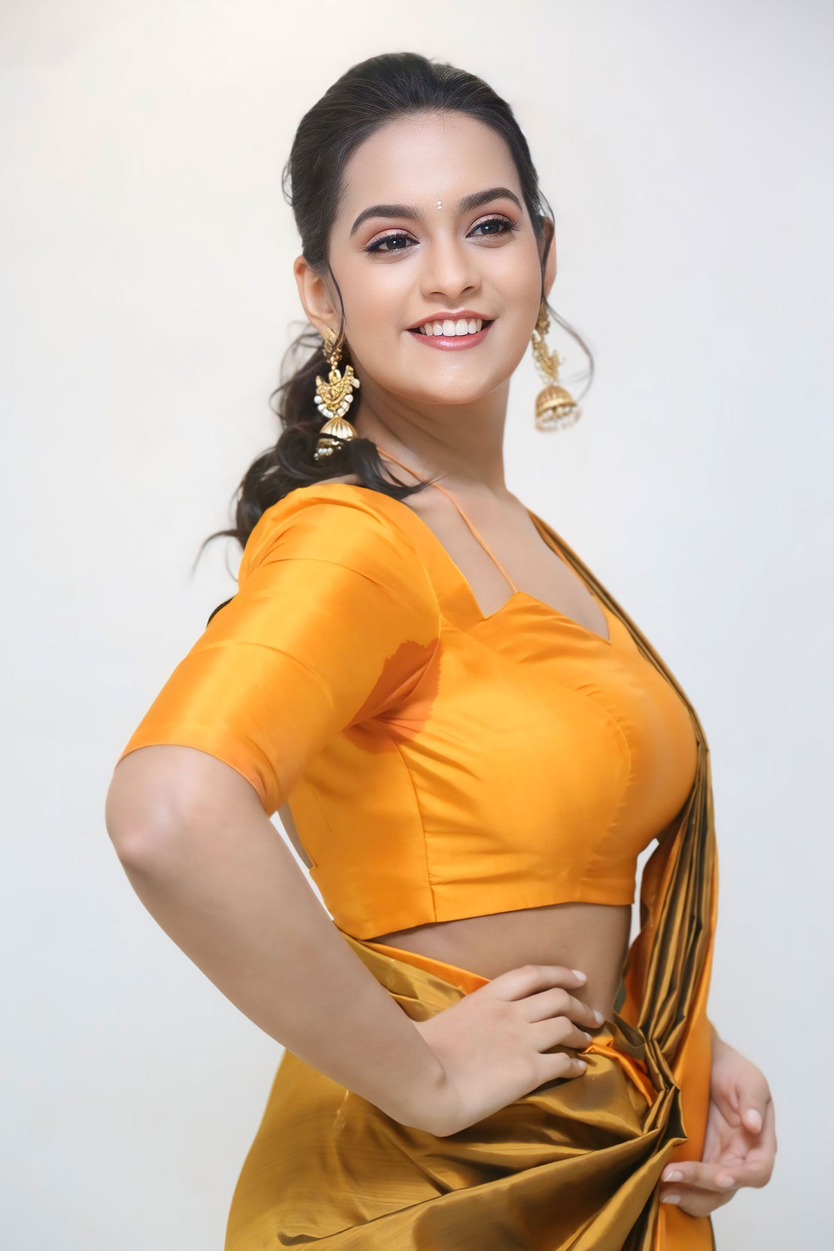 Actress Samaira Sri Golden Mustard Saree and Antique Jhumkas