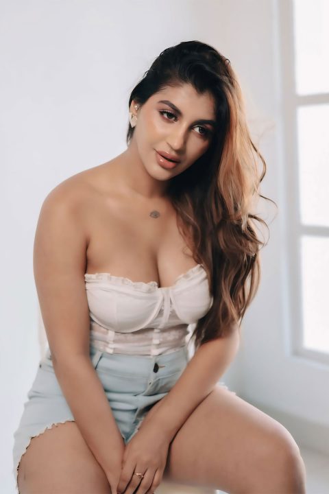 Yashika Aannand Sexy Cleavage Look in White Lace Corset Photos