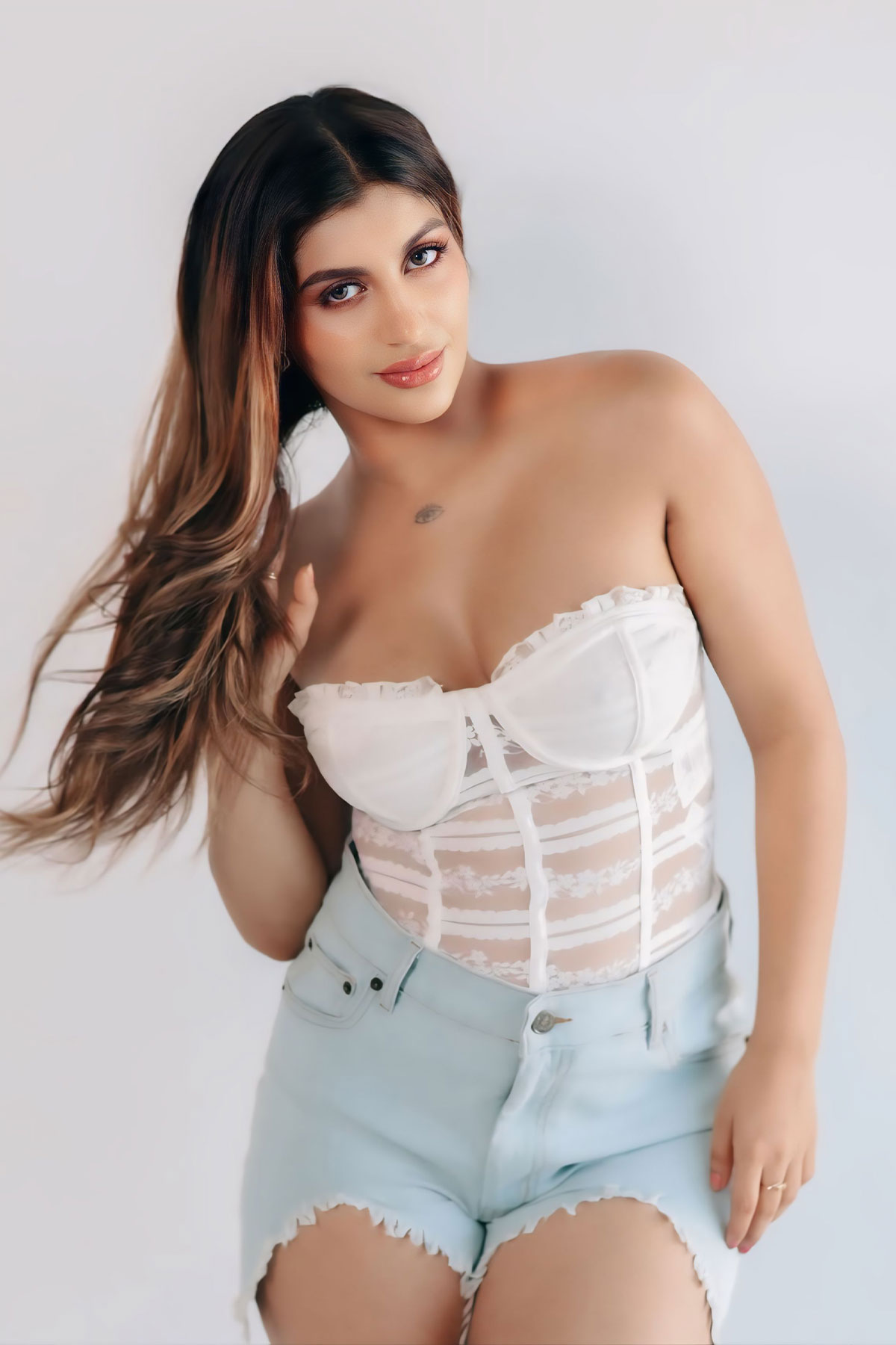 Yashika Aannand Sexy White Corset Photoshoot with Bold Style
