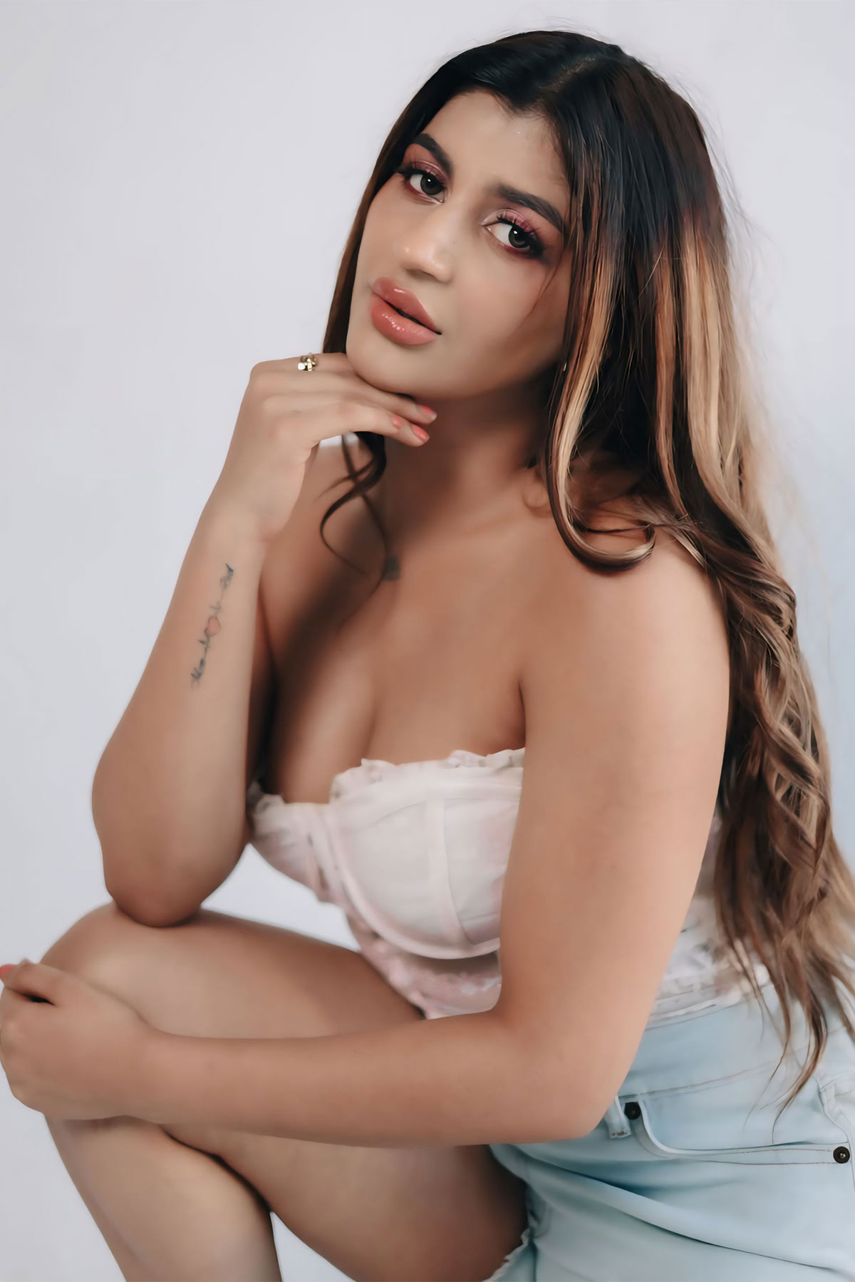 Yashika Aannand Bold Cleavage Photos in White Lace Corset Outfit