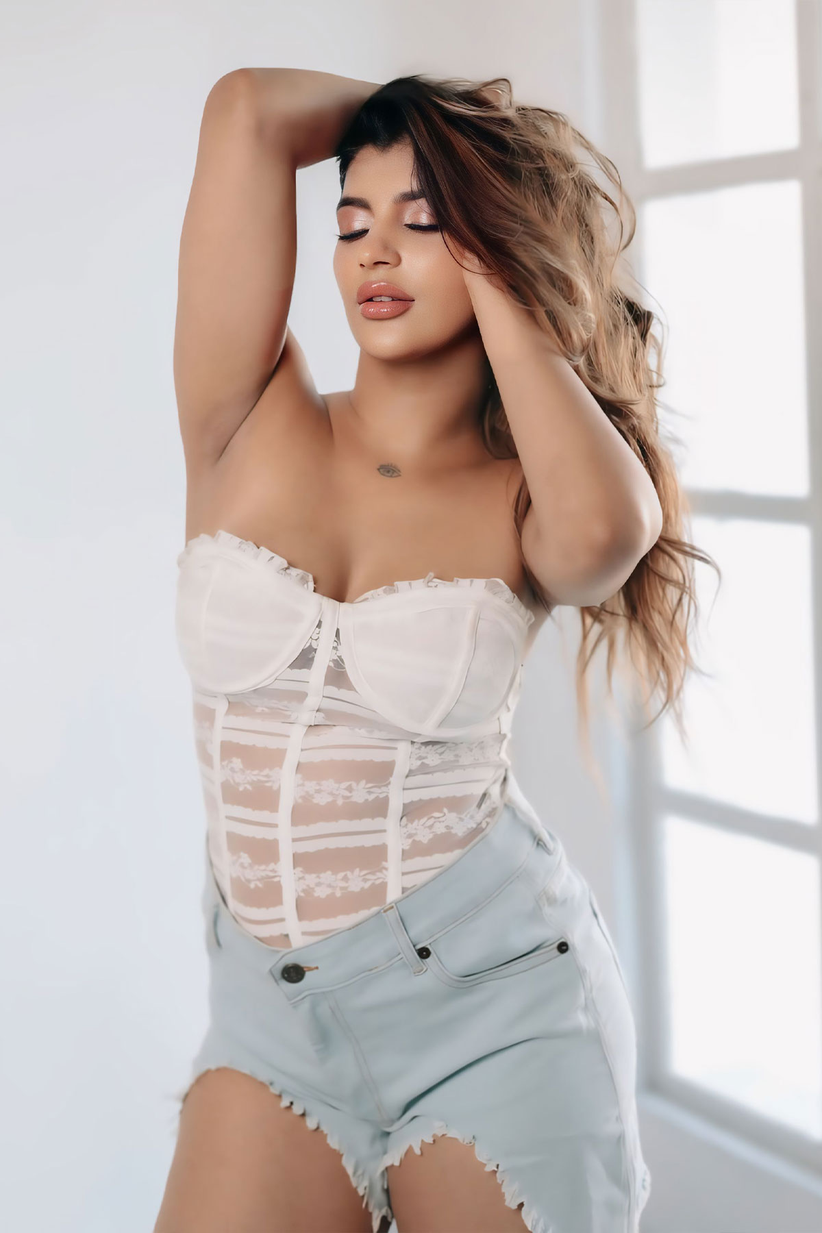 Yashika Aannand Hot White Corset and Denim Shorts