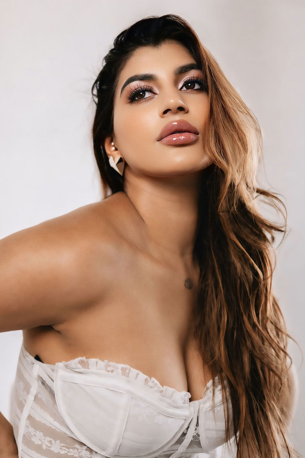 Yashika Aannand Hot Glamorous Stills in White Lace Corset Top