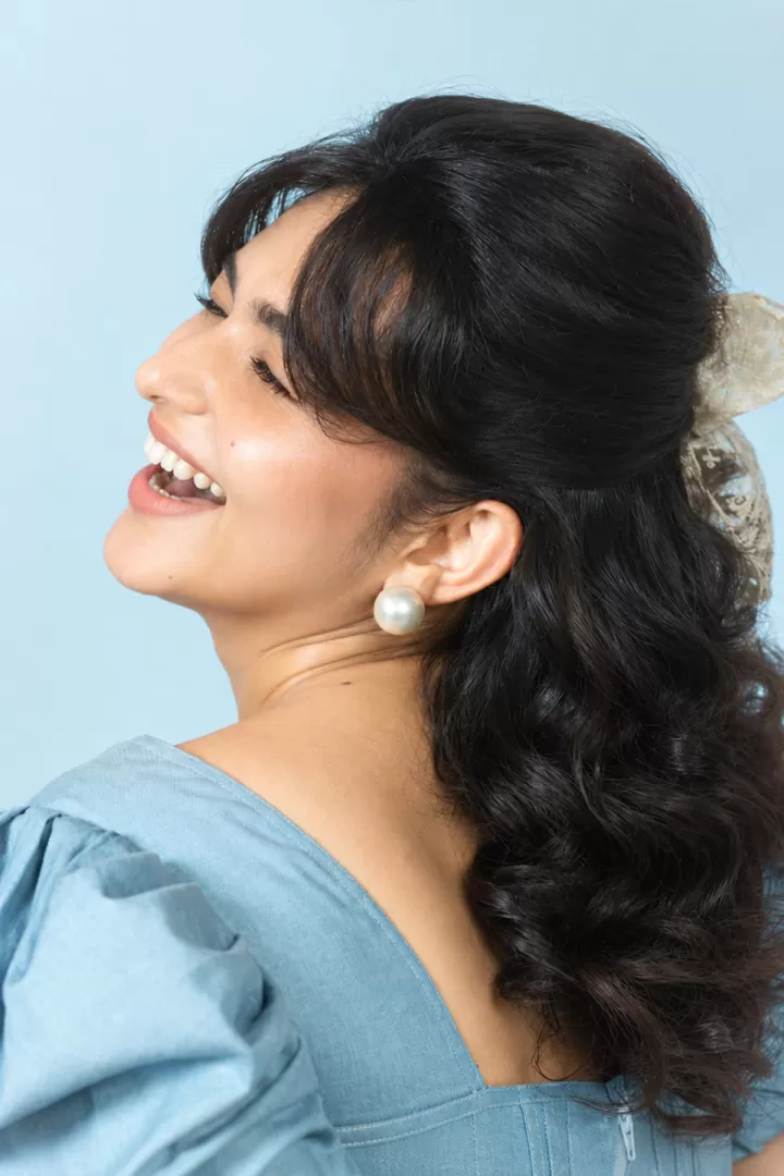 Kayadu Lohar Candid Laughing Pose with Vintage Curly Hairstyle